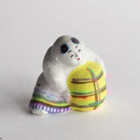 Shitakawara-yaki clay dolls, CHILD HOLDING A RICE BALE